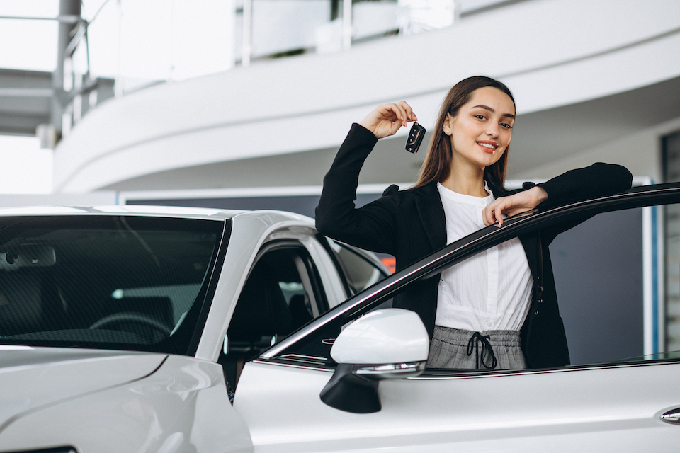 woman-choosing-car-car-showroom.jpg